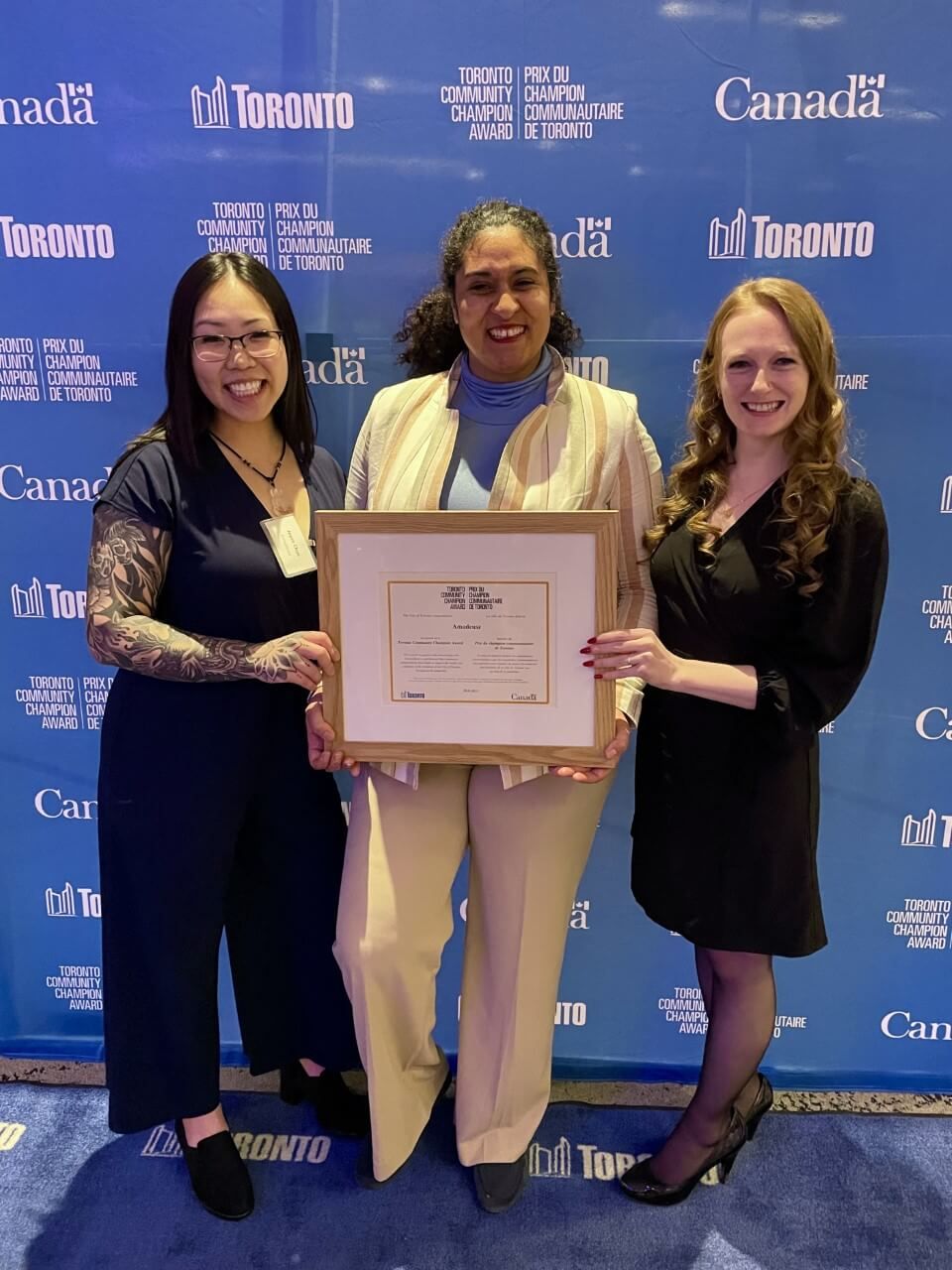 Amadeusz's management team at the Toronto Community Champion award